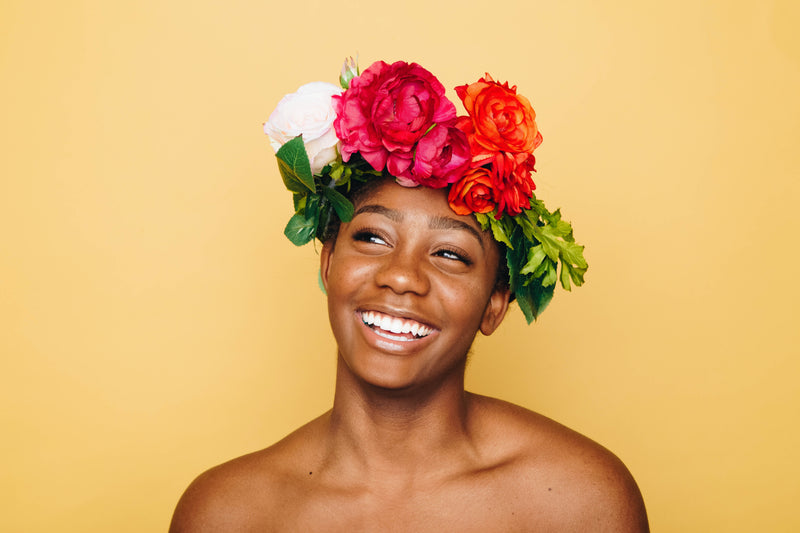 woman-smiling-wearing-flower-crown