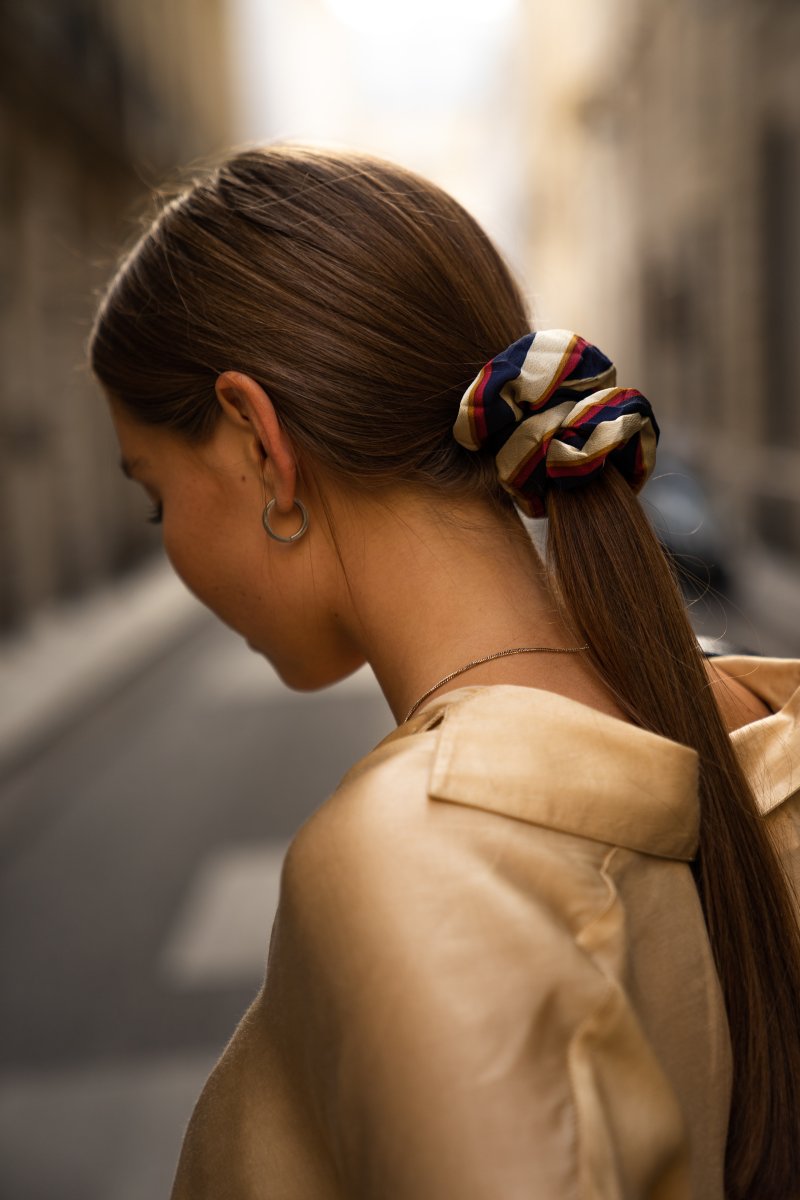 woman-with-low-pony-tail-looking-down